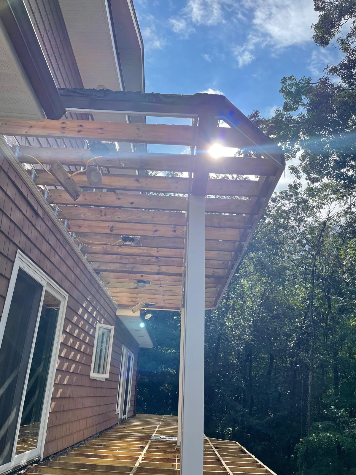Pergola construction over deck